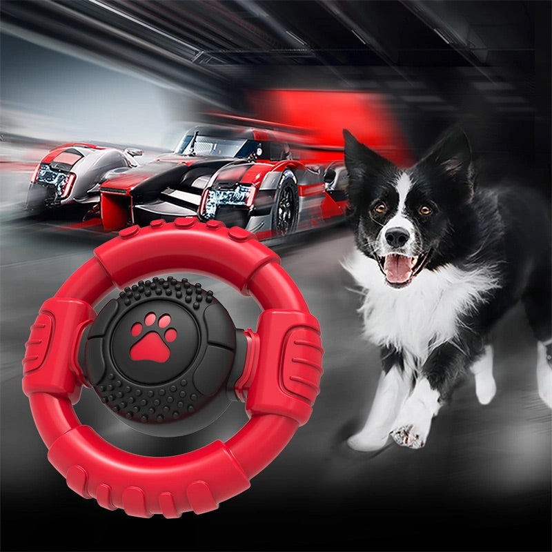 Dog proudly holding the Ultra Durable Steering Wheel Dog Toy in its mouth - Encourages active play and exercise